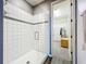 Modern bathroom featuring a walk-in shower with white tile and glass door at 8858 Tuscany Isles Dr, Punta Gorda, FL 33950