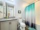 Bathroom with a shower/tub combination with a tiled backsplash and a vanity at 8858 Tuscany Isles Dr, Punta Gorda, FL 33950