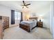 Comfortable bedroom with a queen bed, wooden nightstands, and soft natural light at 8858 Tuscany Isles Dr, Punta Gorda, FL 33950