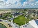 Beautiful aerial view showcasing the community's green spaces, walkways, and modern architecture under a partly cloudy sky at 1022 S Lavina St, North Port, FL 34286