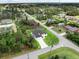 Aerial view showcasing the home's location within a peaceful, tree-lined neighborhood at 1022 S Lavina St, North Port, FL 34286