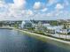 Scenic waterfront view of community buildings with modern architecture, lush landscaping, and a picturesque waterfront setting at 1022 S Lavina St, North Port, FL 34286