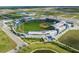 Aerial shot showcasing a well-maintained baseball stadium with lush green fields and modern architecture at 1022 S Lavina St, North Port, FL 34286