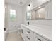 Well-lit bathroom boasts an extended vanity with modern fixtures and ample counter space at 1022 S Lavina St, North Port, FL 34286