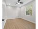 Inviting bedroom with wood-look floors, recessed lighting, and a window view of the outdoors at 1022 S Lavina St, North Port, FL 34286