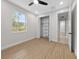 Bedroom with wood-look floors and closet, creating ample space for storage and comfort at 1022 S Lavina St, North Port, FL 34286