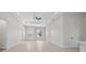 Expansive living room boasts high ceilings, recessed lighting, and a neutral color palette at 1022 S Lavina St, North Port, FL 34286
