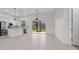 Open concept living area with sliding glass doors to lanai and eat-in kitchen at 1022 S Lavina St, North Port, FL 34286