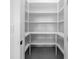 Walk-in pantry with ample shelving for organized storage at 1022 S Lavina St, North Port, FL 34286
