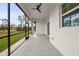 Covered lanai with ceiling fan offers the perfect spot to relax and enjoy the outdoors at 1022 S Lavina St, North Port, FL 34286