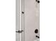 Close-up of shower with sleek fixtures and a large-tile surround at 1022 S Lavina St, North Port, FL 34286