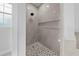 The shower has a gray tile surround and a window at 1022 S Lavina St, North Port, FL 34286