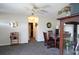 Cozy dining area featuring a traditional table set, ceiling fan, and gray carpet at 21422 Mallory Ave, Port Charlotte, FL 33952