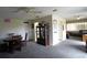 Living area featuring an open floor plan, neutral colors, and a ceiling fan at 21422 Mallory Ave, Port Charlotte, FL 33952
