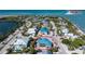 Aerial view of a house under construction near the water at 10009 Gasparilla Pass Blvd, Boca Grande, FL 33921