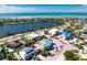 Aerial view of a house under construction by the water at 10009 Gasparilla Pass Blvd, Boca Grande, FL 33921