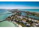 Aerial view of waterfront homes and community at 10009 Gasparilla Pass Blvd, Boca Grande, FL 33921