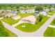 Aerial view of a pink house on a corner lot near a lake at 256 Coblentz St, Port Charlotte, FL 33954