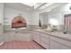 Bathroom with double sinks, a bathtub, and pink tile floors at 256 Coblentz St, Port Charlotte, FL 33954