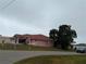 Single-story home with a tiled roof and landscaped yard at 256 Coblentz St, Port Charlotte, FL 33954
