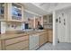 Kitchen with light wood cabinets and a dishwasher at 256 Coblentz St, Port Charlotte, FL 33954