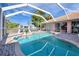Inviting kidney-shaped pool with a screened enclosure at 256 Coblentz St, Port Charlotte, FL 33954