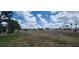 Spacious backyard with a partial view of the golf course at 443 Madrid Blvd, Punta Gorda, FL 33950