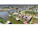 Wide aerial showcasing waterfront home and neighborhood at 15706 Viscount Cir, Port Charlotte, FL 33981