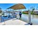 Covered boat lift on private dock perfect for storing a boat at 15706 Viscount Cir, Port Charlotte, FL 33981