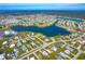 Aerial view showing home's location near a lake at 6287 Oriole Blvd, Englewood, FL 34224