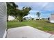 Spacious backyard with large tree and grassy area at 6287 Oriole Blvd, Englewood, FL 34224