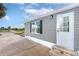 Gray mobile home exterior with white door and black shutters at 6287 Oriole Blvd, Englewood, FL 34224