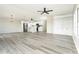 Open concept living and kitchen area with gray vinyl flooring at 6287 Oriole Blvd, Englewood, FL 34224