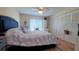 Main bedroom with a blue headboard and ample closet space at 2437 Harbor Blvd # 219, Port Charlotte, FL 33952