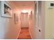 Clean hallway with light walls and wood-look flooring at 2437 Harbor Blvd # 219, Port Charlotte, FL 33952