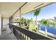 Spacious screened balcony overlooking water and lush landscaping at 1080 Bal Harbor Blvd # 1C, Punta Gorda, FL 33950