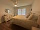 Main bedroom with a dresser, large bed, and ceiling fan at 1080 Bal Harbor Blvd # 1C, Punta Gorda, FL 33950