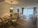 Condo dining area with glass table and seating for four at 1080 Bal Harbor Blvd # 1C, Punta Gorda, FL 33950