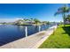 Scenic waterfront view with dock and lush landscaping at 1080 Bal Harbor Blvd # 1C, Punta Gorda, FL 33950