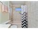 Clean bathroom with shower/tub combo, tile surround, and vanity at 523 Foxwood Blvd, Englewood, FL 34223