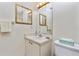 Clean bathroom with single sink vanity and toilet at 523 Foxwood Blvd, Englewood, FL 34223
