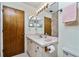 Bathroom features a vanity, sink, toilet, and mirrored medicine cabinet at 523 Foxwood Blvd, Englewood, FL 34223