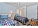 Bedroom with two twin beds, ceiling fan and closet at 523 Foxwood Blvd, Englewood, FL 34223