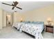 Bedroom with two twin beds, ceiling fan, and ample closet space at 523 Foxwood Blvd, Englewood, FL 34223