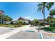 Community clubhouse with ample parking and landscaping at 523 Foxwood Blvd, Englewood, FL 34223