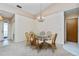 Simple dining room with a glass-top table and wicker chairs at 523 Foxwood Blvd, Englewood, FL 34223