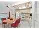 Clean and efficient kitchen with white cabinets and a breakfast nook at 523 Foxwood Blvd, Englewood, FL 34223