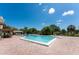 Community pool with brick patio and ample lounge chairs at 523 Foxwood Blvd, Englewood, FL 34223