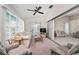 Sunroom features ample natural light, comfy seating and views of the backyard at 523 Foxwood Blvd, Englewood, FL 34223