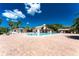 Community swimming pool with brick patio and lounge chairs at 523 Foxwood Blvd, Englewood, FL 34223